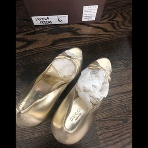 Brand new Gucci wedges in gold.  Size 6.